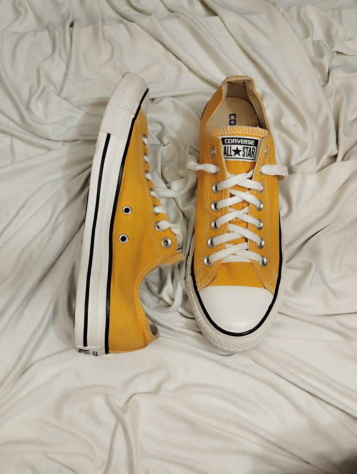 Yellow low rise converse